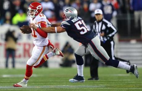 Patriots defensive end Rob Ninkovich pursued Chiefs quarterback Alex Smith in the first quarter.
